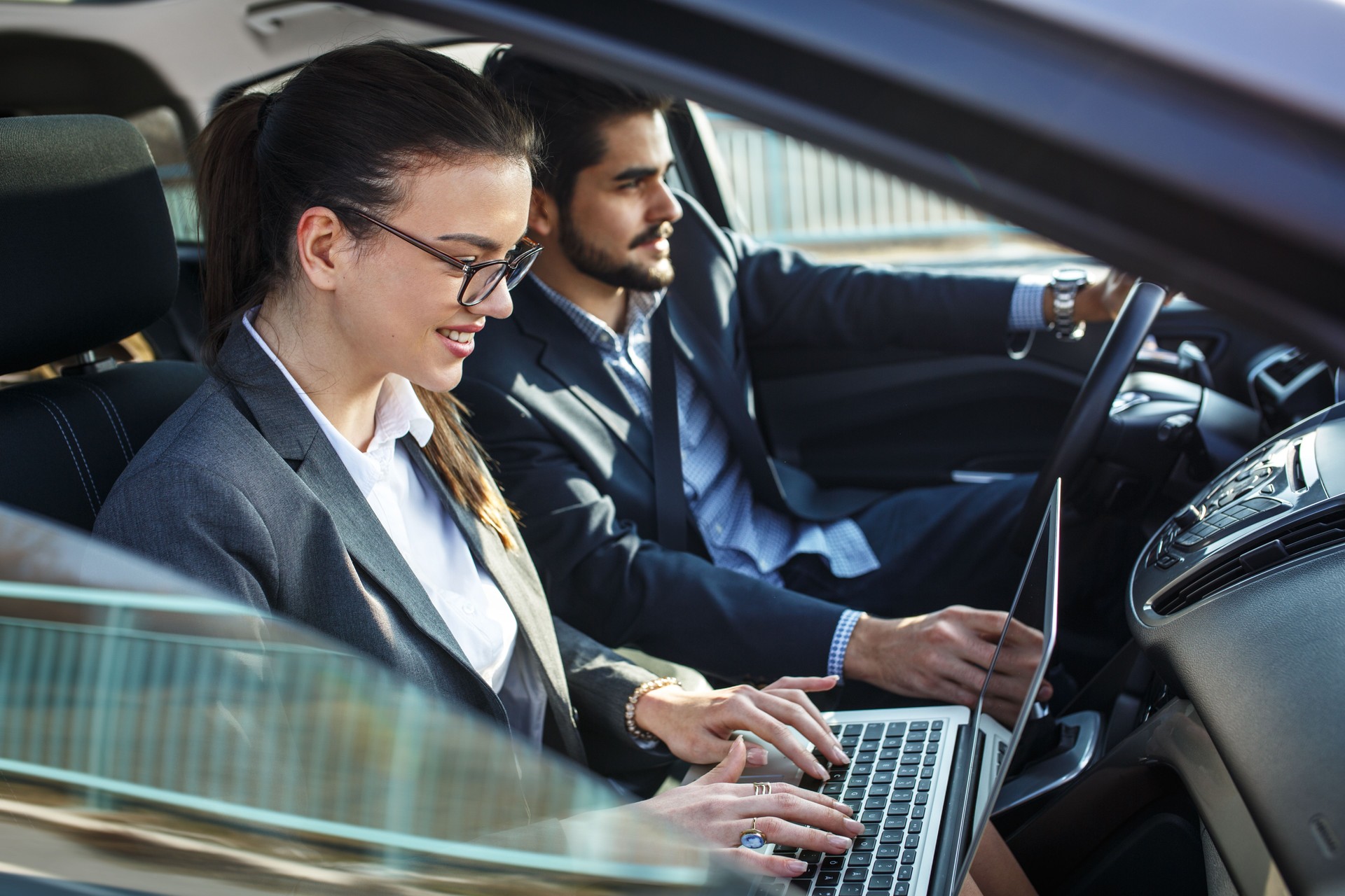 Two business people in the car.